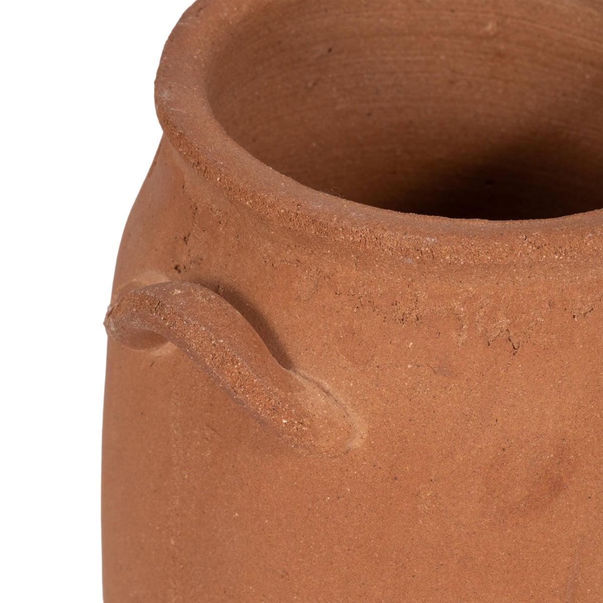 Close-up of a terracotta pot with a handle on a white background