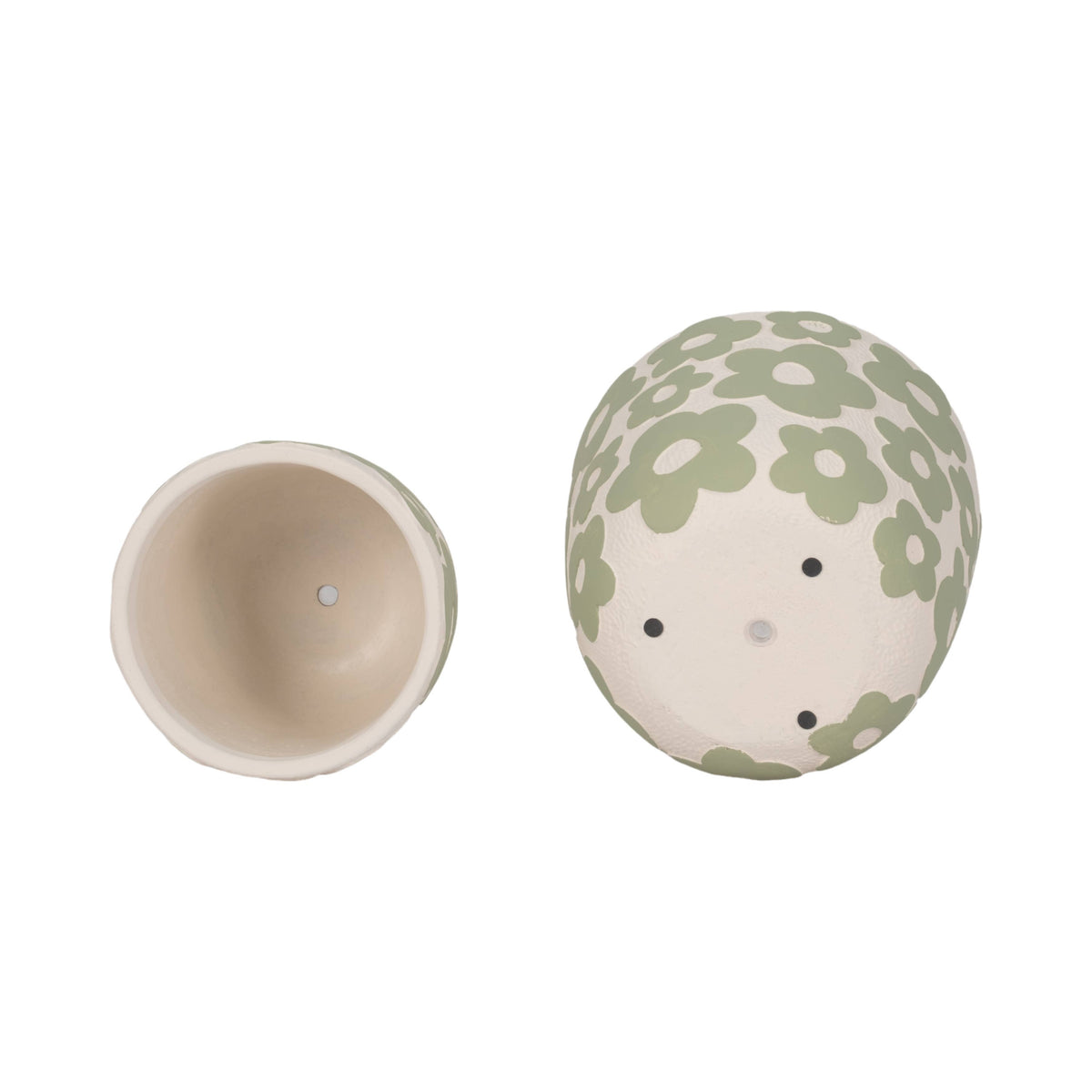 Round ceramic container with floral pattern on a white background