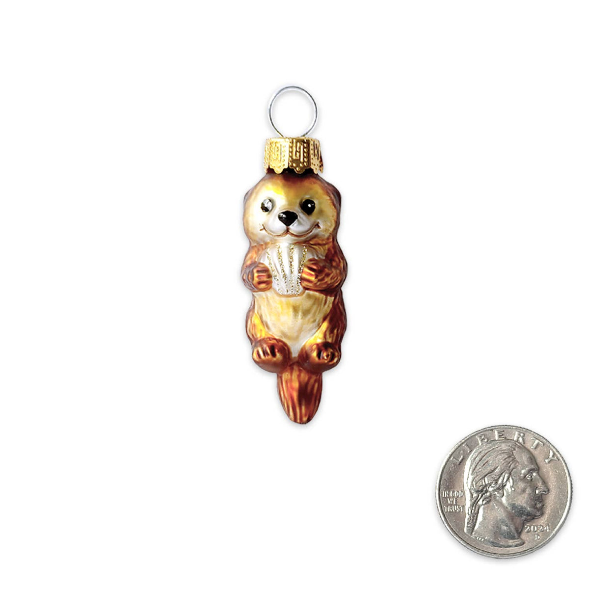 A small handcrafted animal ornament shaped like a brown and cream beaver holding a white basket, shown on a plain white background with a U.S.