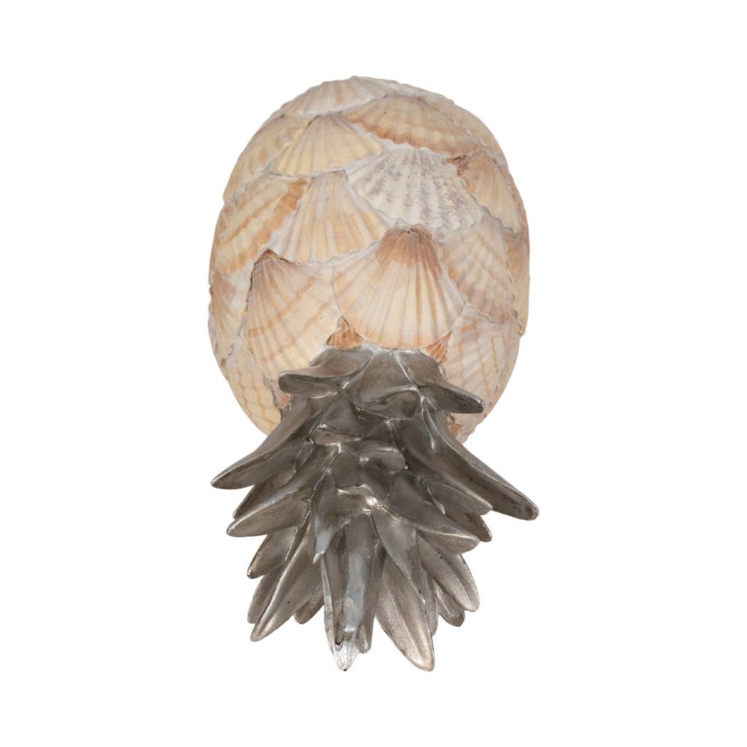 Decorative wall sconce with shell and pineapple design on a white background