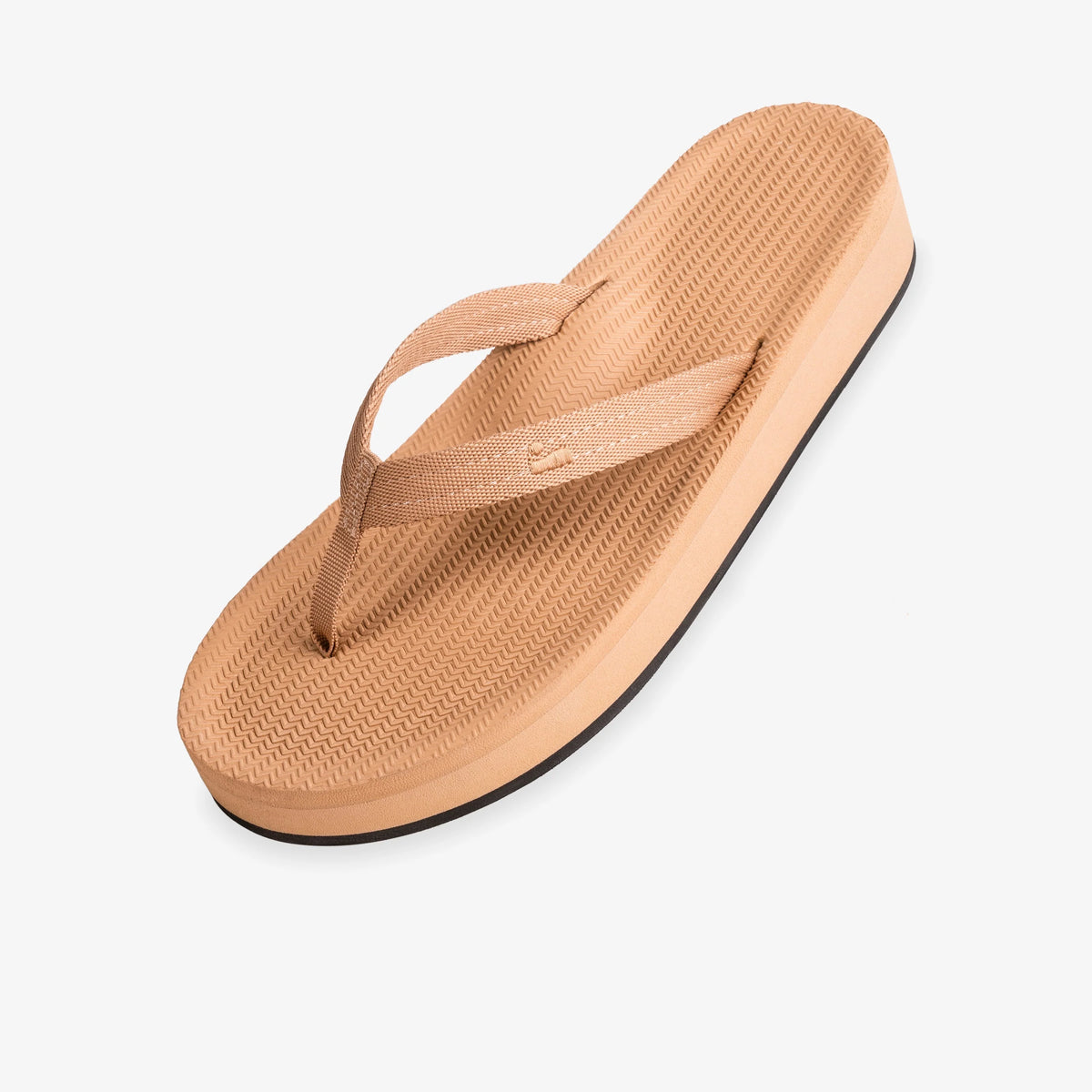 Tan sandal with a black sole on a white background