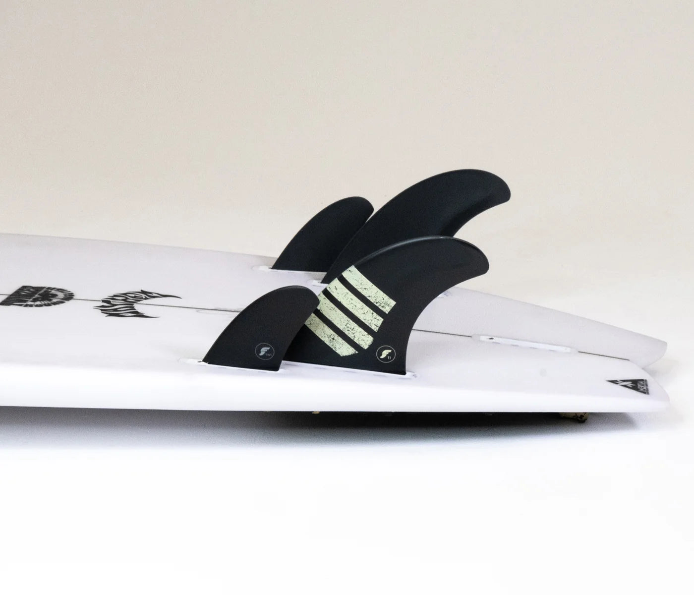 Futures TW1 Alpha Canard Pair (9 Degree) on a surfboard