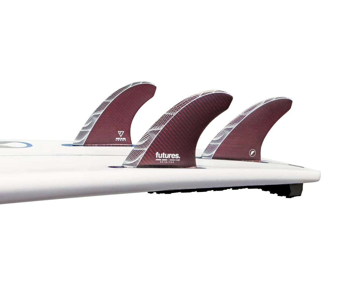 Close-up of a surfboard with three JJF Vapor Core Scimitar Thruster Fins (Red) fins on a white background, featuring the 'futures' brand.