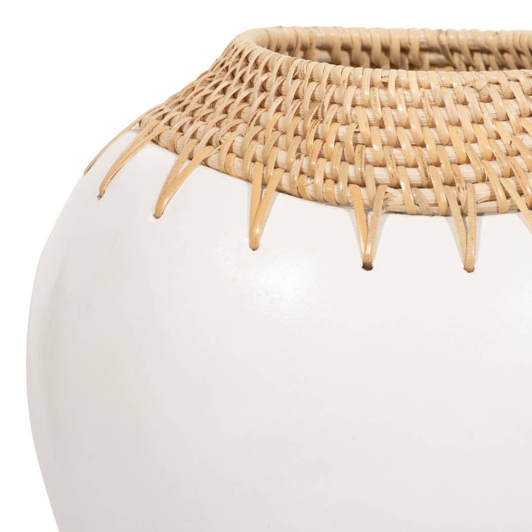 White vase with a woven rattan top on a white background