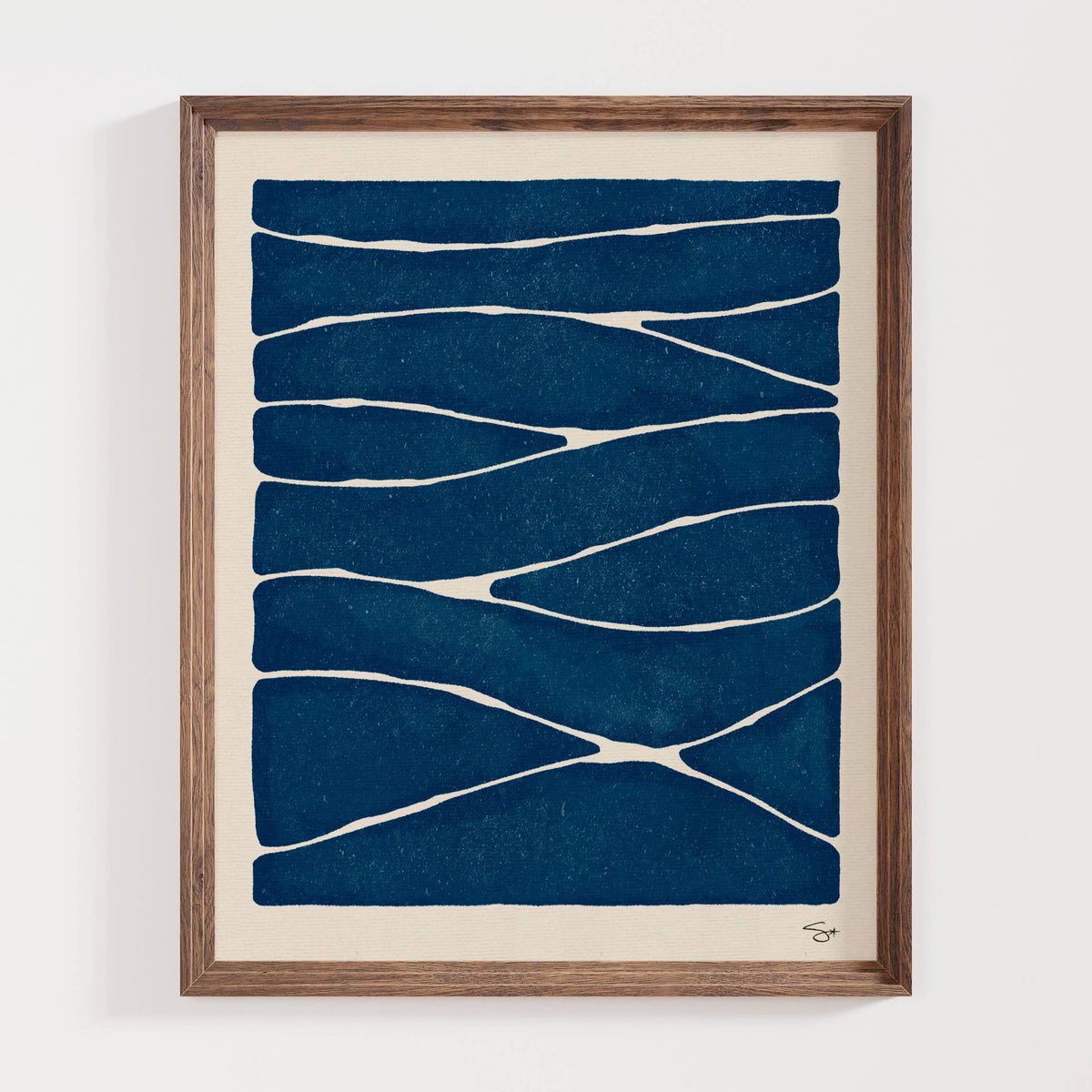 Framed abstract art with blue and white pattern on a beige background