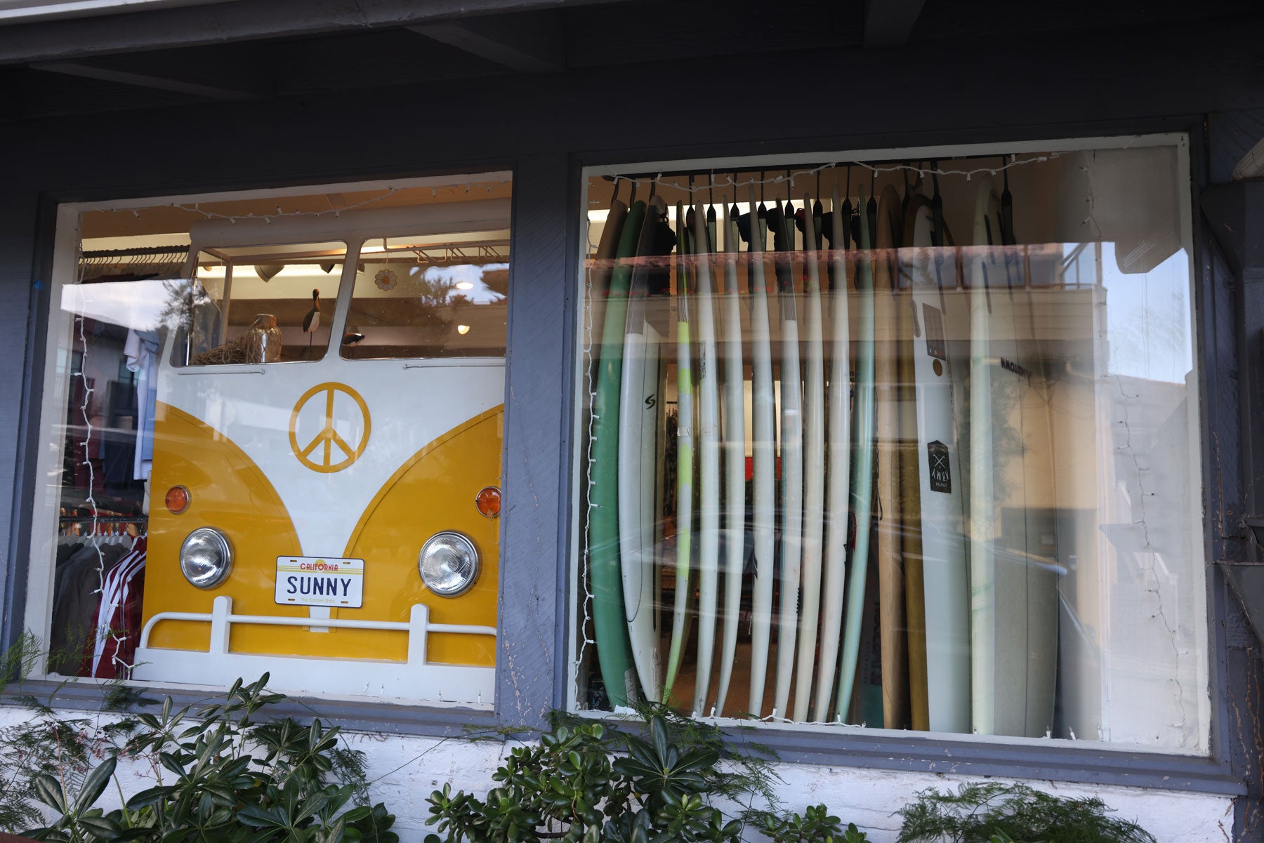 Window display of surfboards at the Sunny California Surf Shop in Carmel California