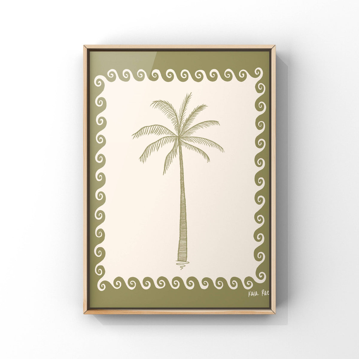 A framed art print featuring a simple palm tree illustration in olive green on an off-white background, surrounded by a decorative wavy border. The print is housed in a thin light wood frame and is shown hanging on a light gray wall.