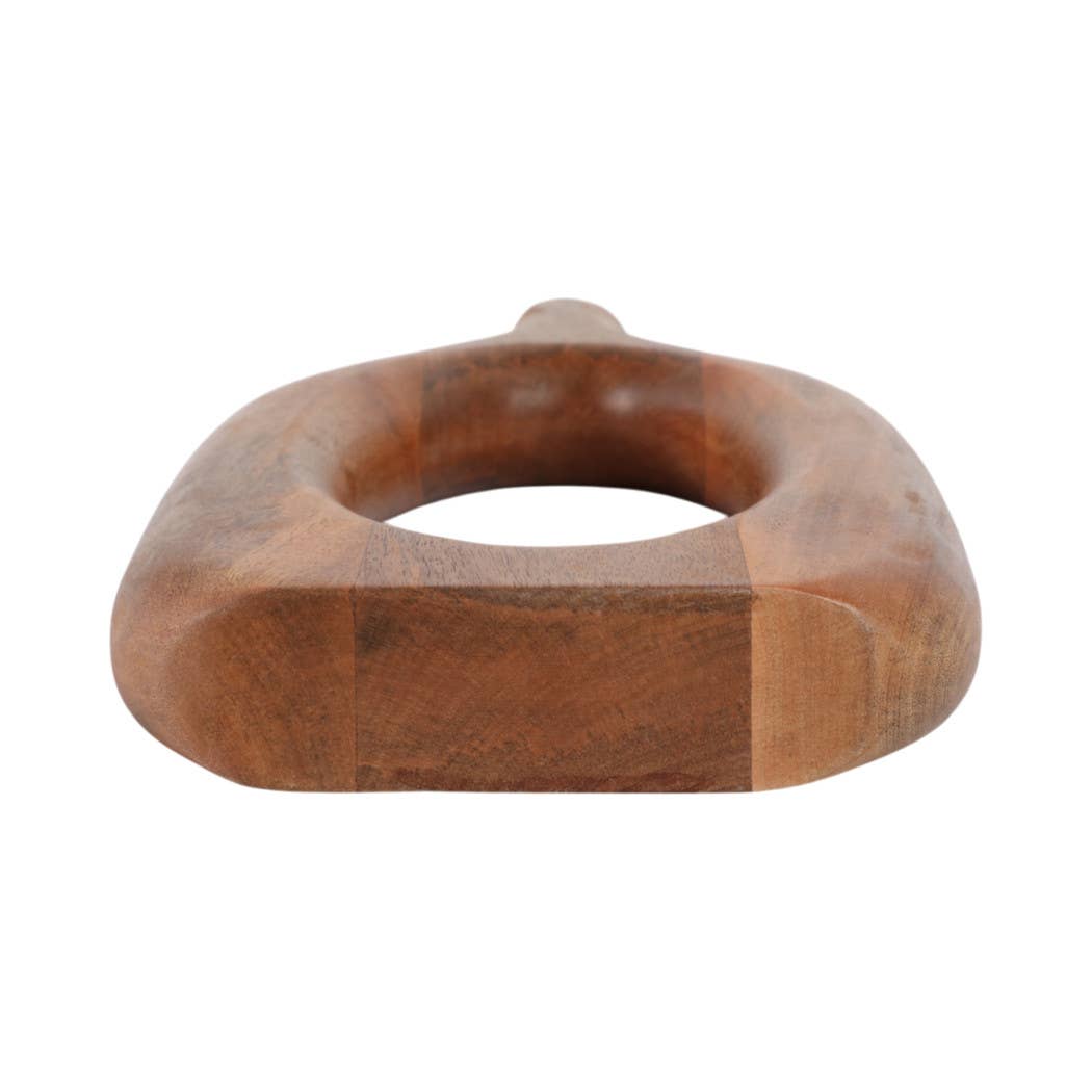 A carved wooden ring-shaped object with a thick base and rounded edges, shown on a plain white background.