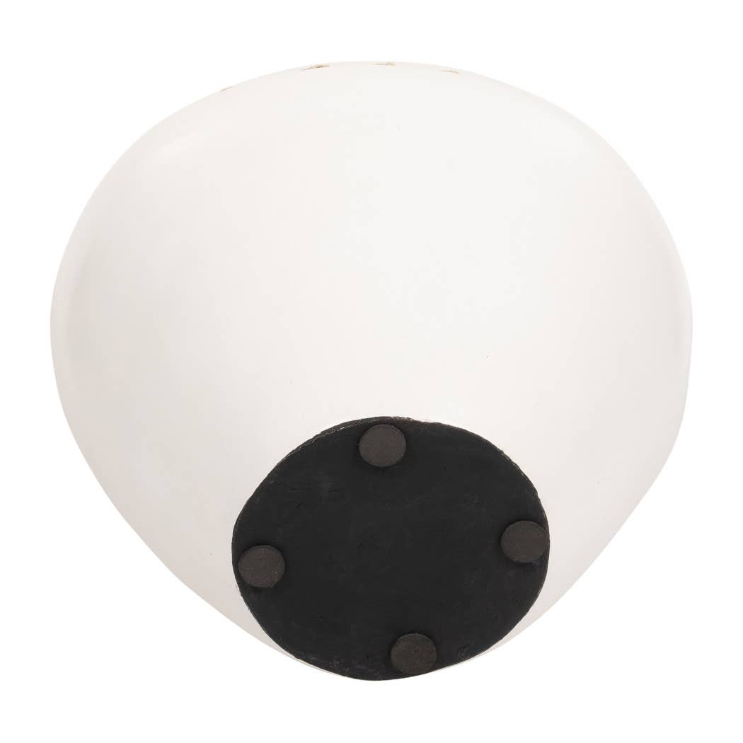 Round white object with a black circular base on a white background