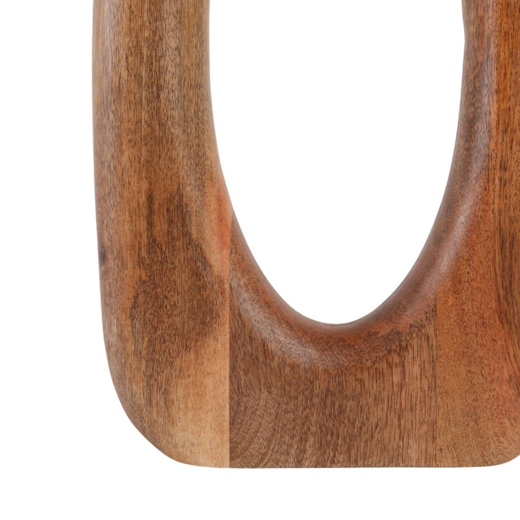 Close-up of a curved wooden object with a smooth, polished finish and visible wood grain texture, isolated on a white background.
