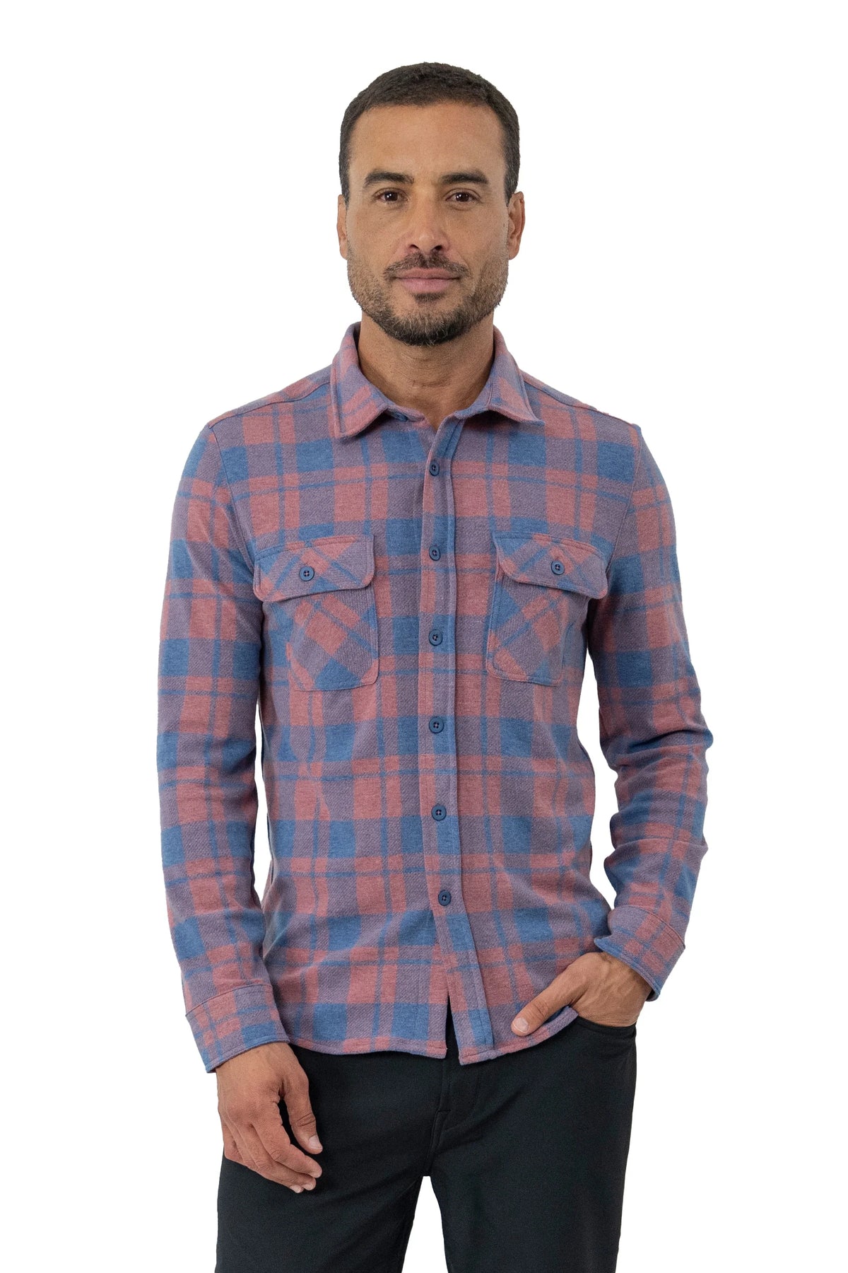 Man wearing blue and red plaid fleece shirt in front of a white background