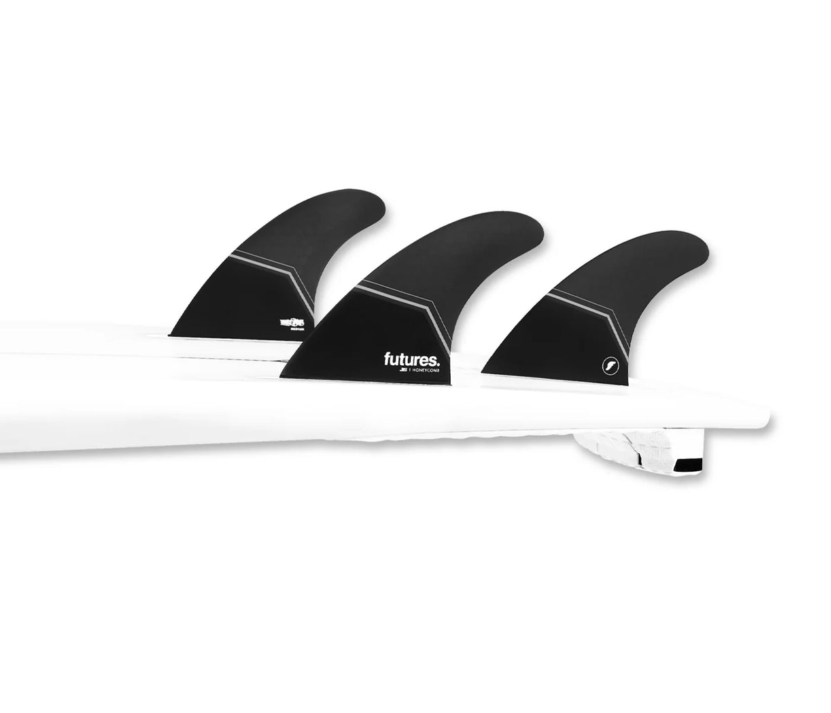 Three black JS Honeycomb Thruster Fins with 'futures' branding on a white background