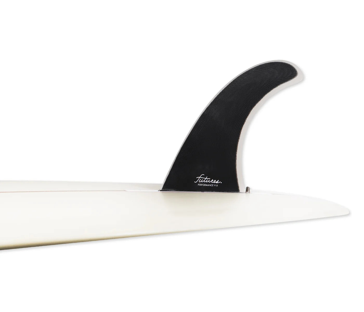 A close-up studio shot of a black Futures Performance Fiberglass Single Fin (9.0") mounted on a white surfboard, photographed against a clean white background.