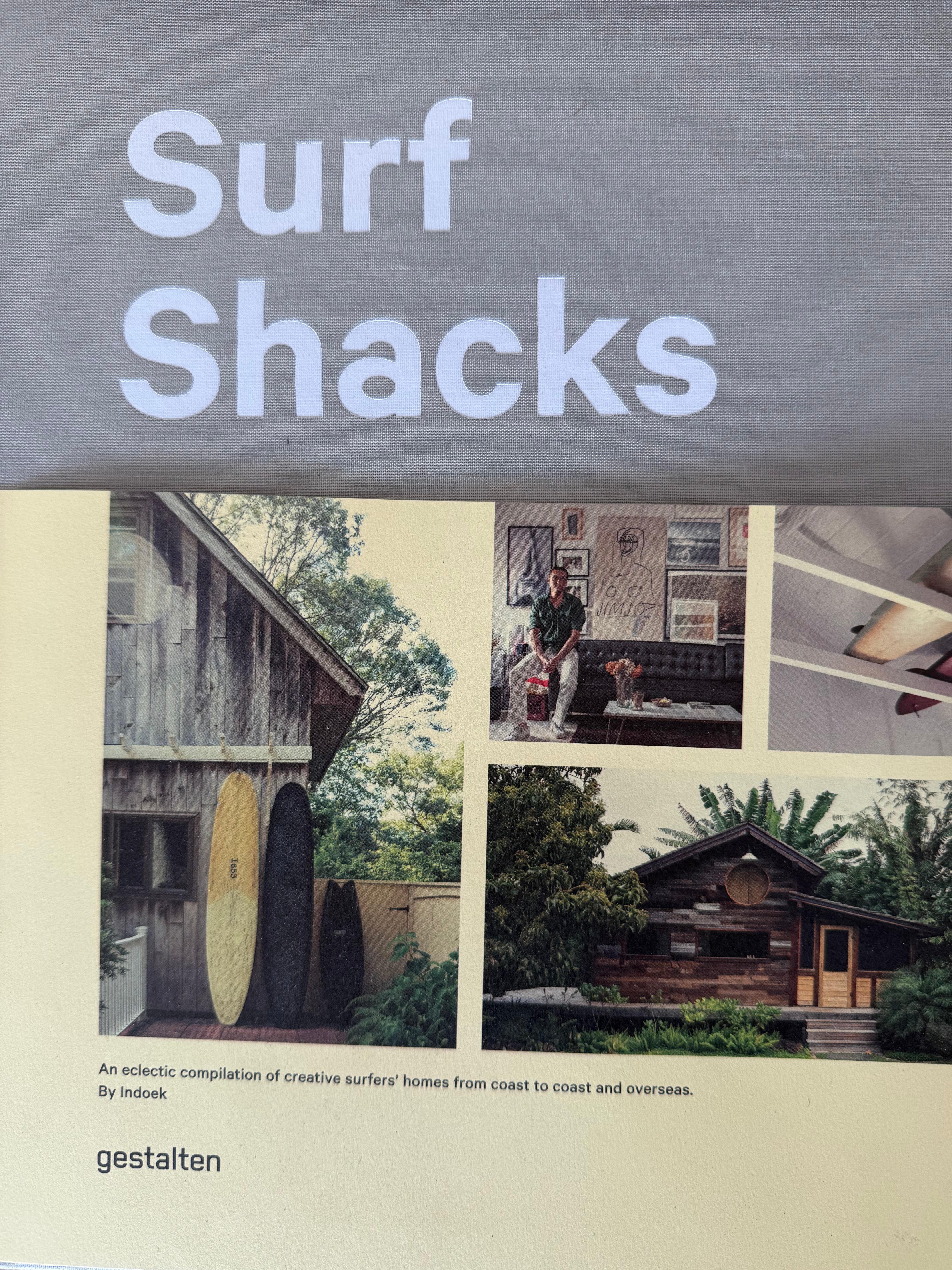 Book cover of 'Surf Shacks' with images of a cabin, interior, and exterior.