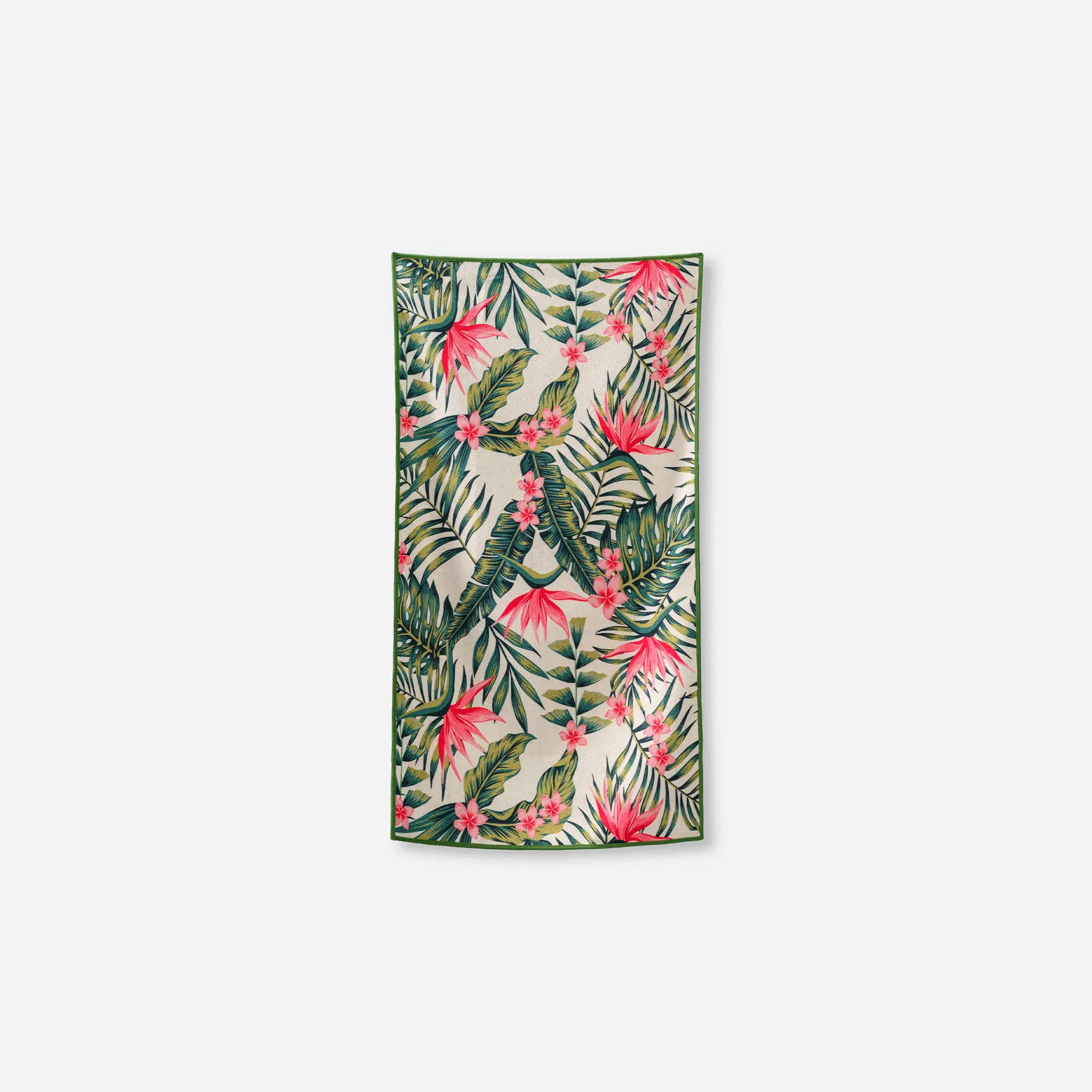 Tropical floral towel with pink flowers and green leaves on a white background