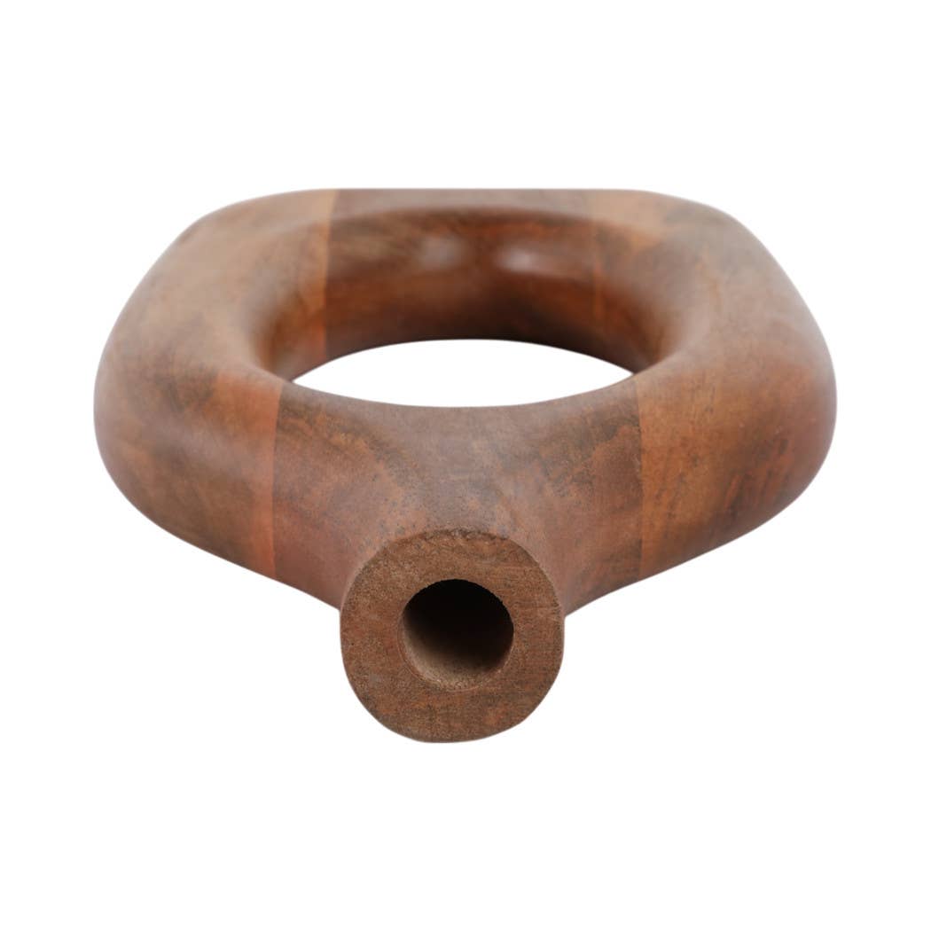 A rustic hand-carved wooden pipe with a thick, rounded body and a flared circular opening, shown on a plain white background.