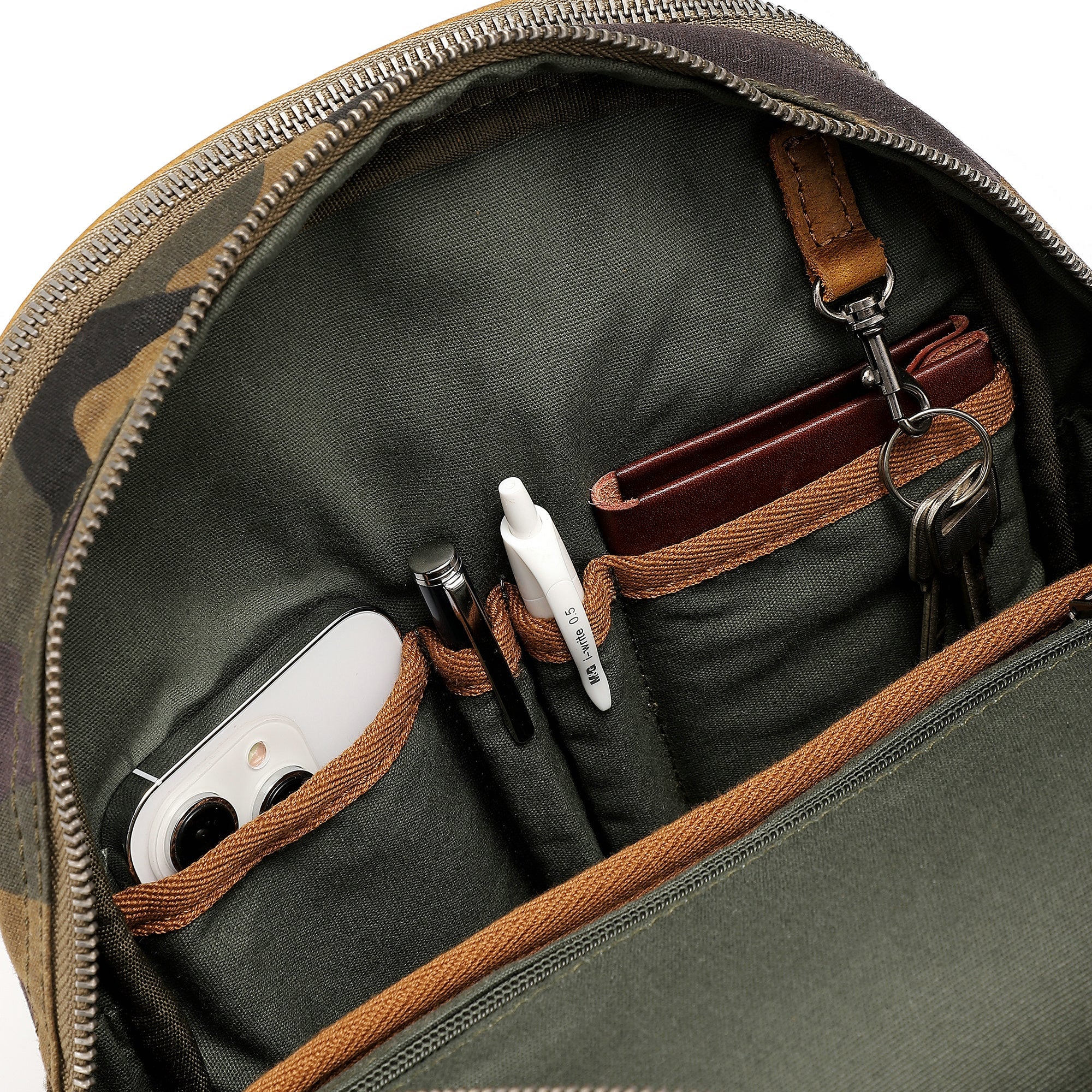 Interior compartments of Mountain Leaf Utility Backpack with pockets and gear storage