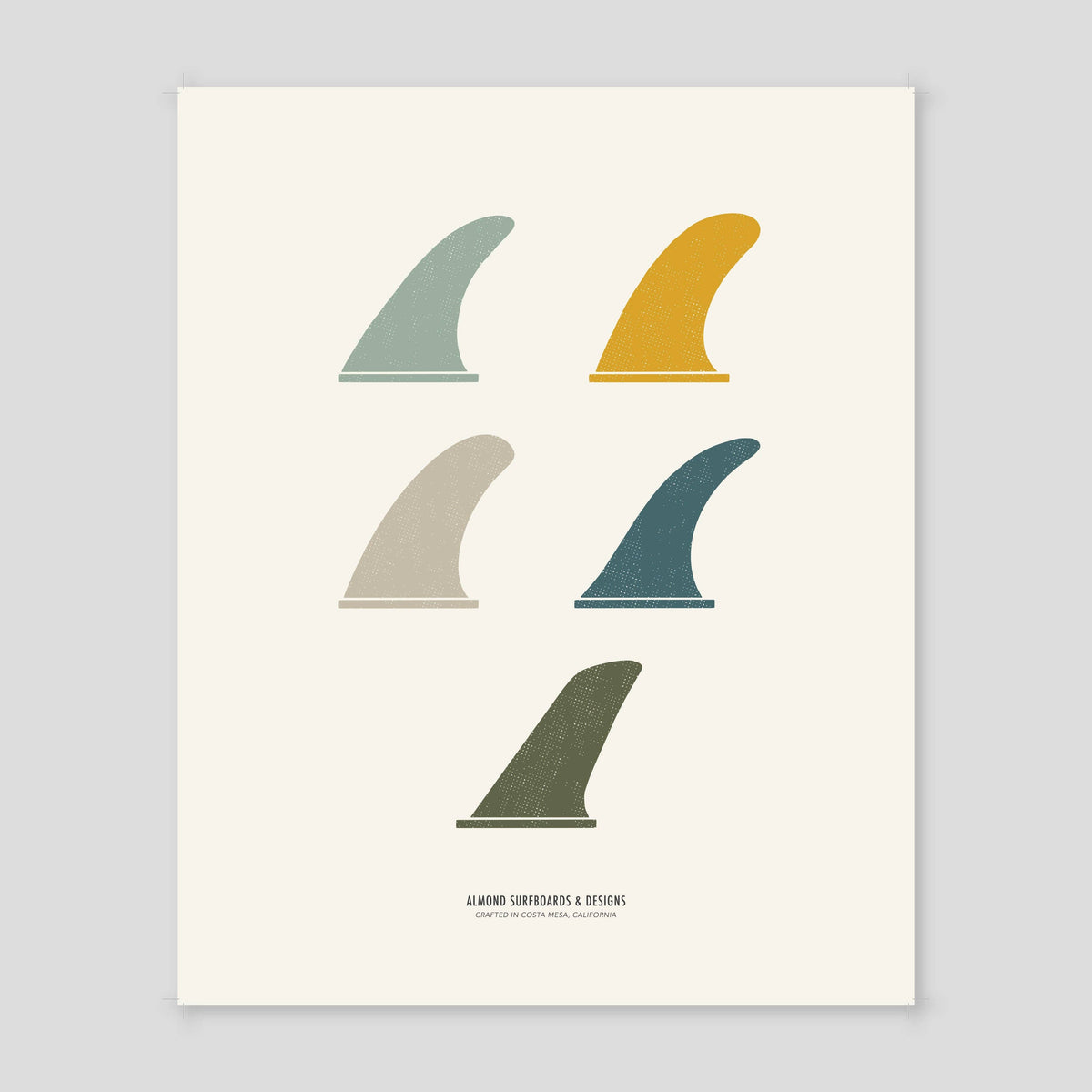 A minimalist art print featuring five surfboard fin silhouettes in muted colors on an off-white background, with the text 'ALMOND SURFBOARDS & BICYCLES' and 'SANTA BARBARA, CALIF.' at the bottom.