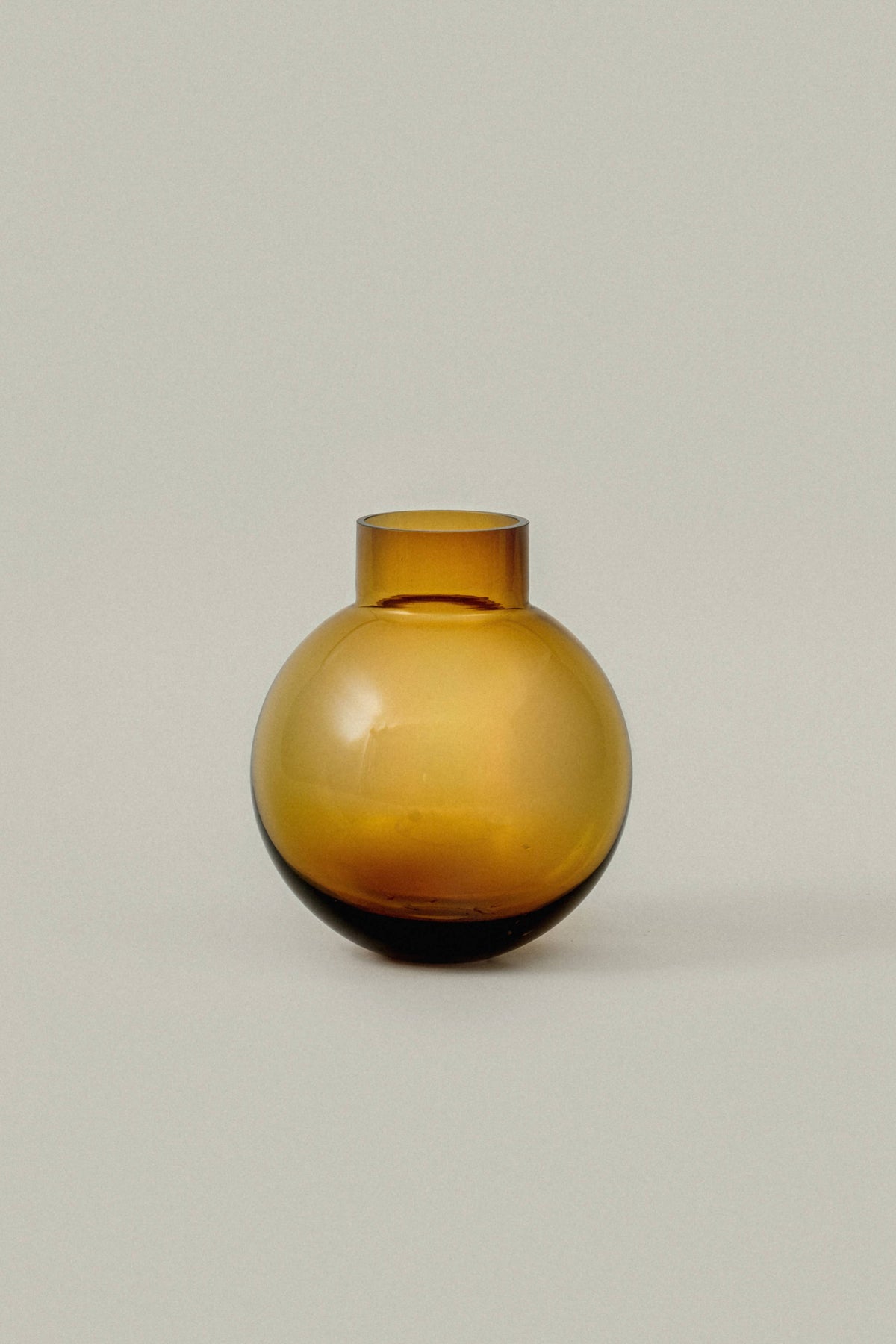 An amber-brown glass vase 