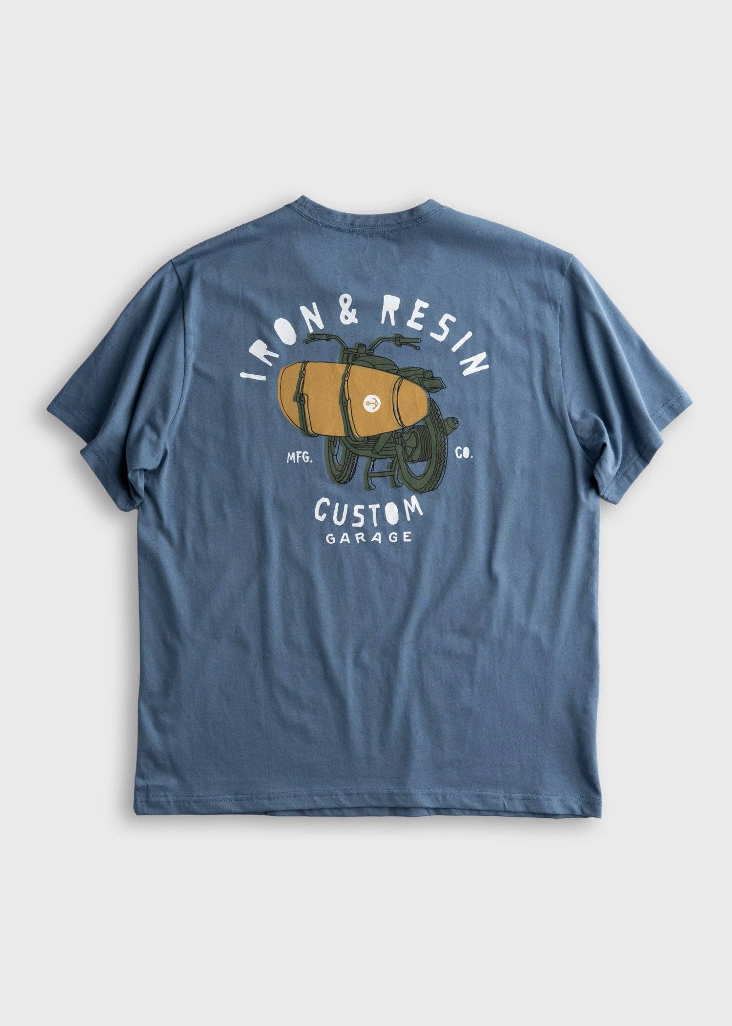 Blue t-shirt with graphic design on the back on a light gray background