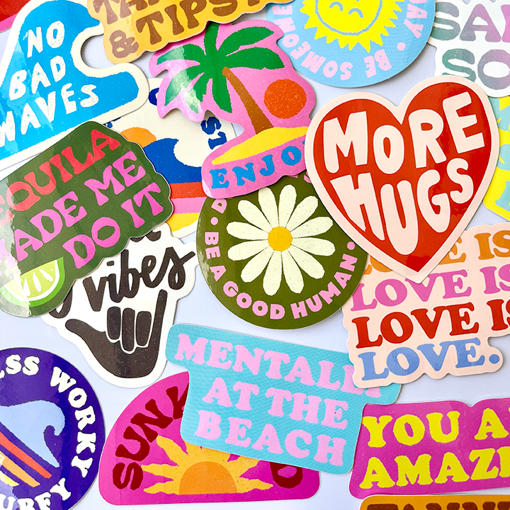 Collection of colorful stickers with various messages on a light blue background