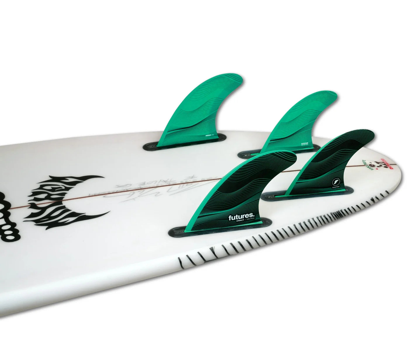 Close-up of a surfboard with Futures F6 Legacy Series Honeycomb 5-Fin Set